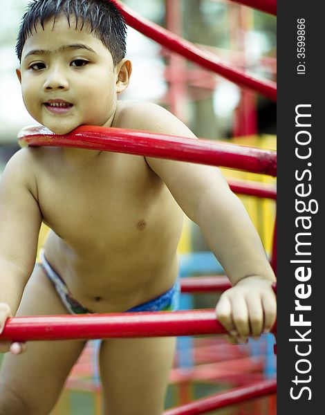 Kid Playing In Playground