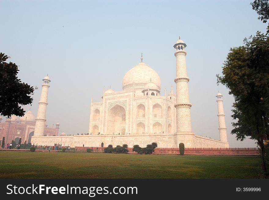 Taj Mahal view from side on misty morning. Taj Mahal view from side on misty morning