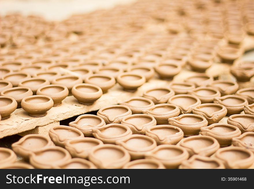 Indian diyas/cups made up of clay by pottery process. Indian diyas/cups made up of clay by pottery process