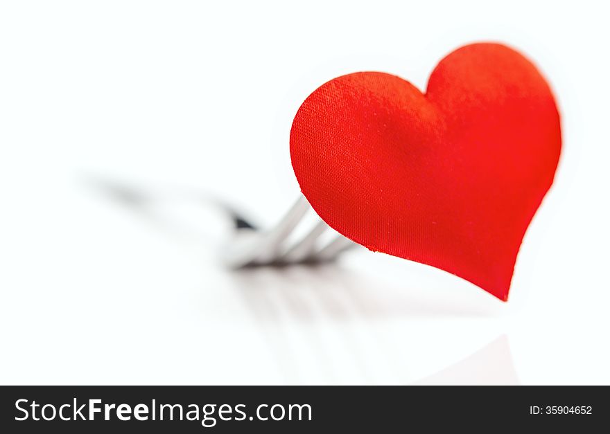 The red heart on a fork cutlery