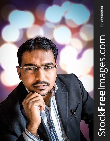 Portrait of young person wearing spects at night with bokeh lights in the background. Portrait of young person wearing spects at night with bokeh lights in the background