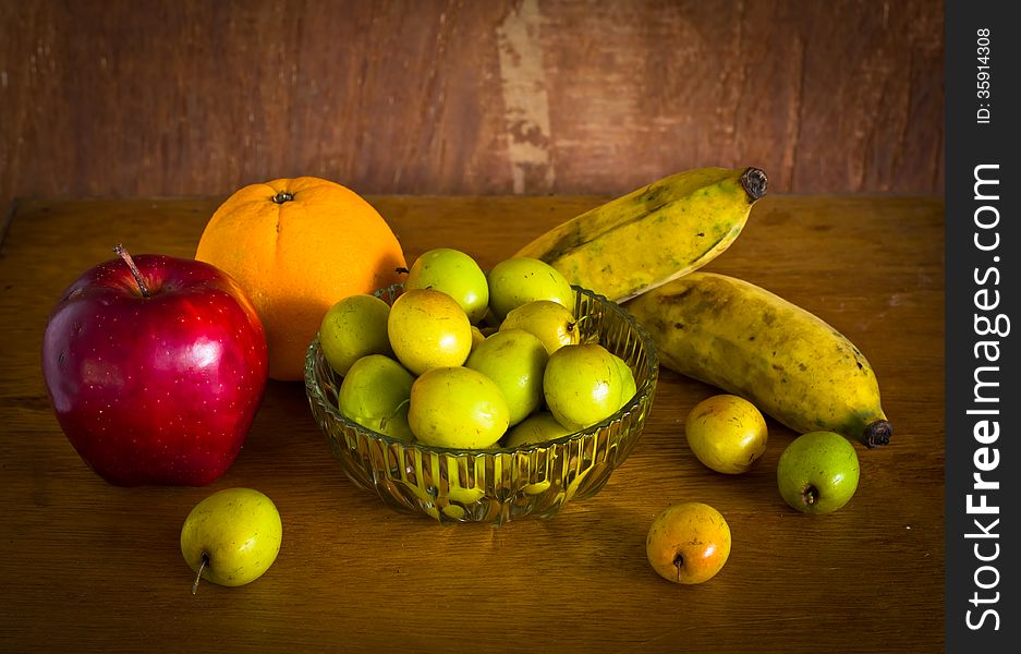 Many kind of fruit on old wood table ,still life. Many kind of fruit on old wood table ,still life