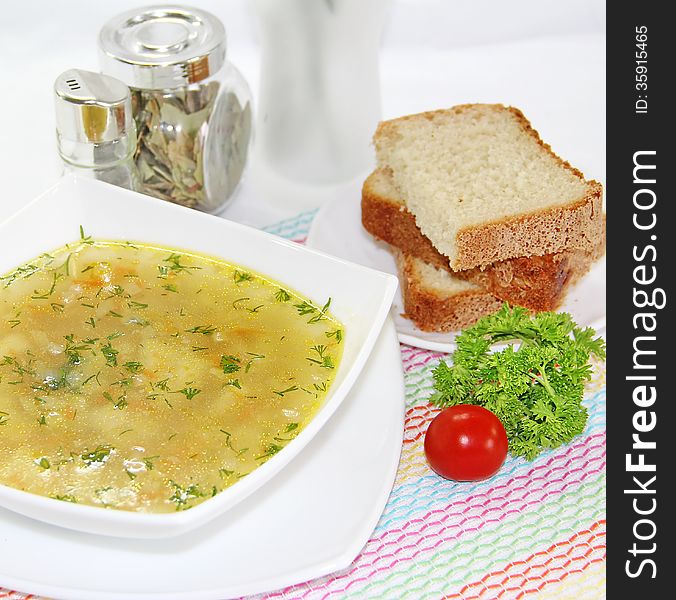 Delicious meat soup on a served table