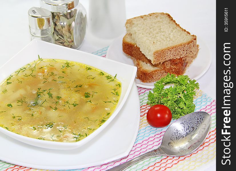 Delicious meat soup on a served table