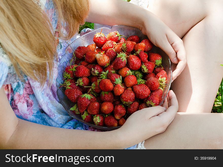 Closeup On Young Woman Holding Strawberry Bowl
