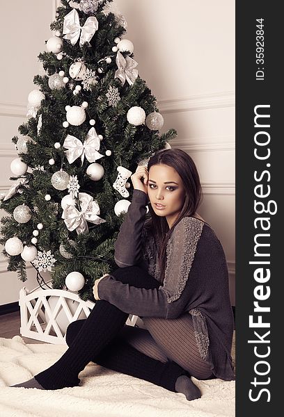 Beautiful girl with decorated Christmas tree. Beautiful girl with decorated Christmas tree
