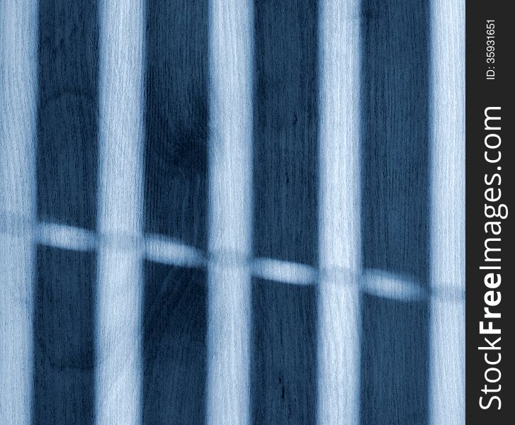 Background or texture blue shadow of the window blinds on the floor