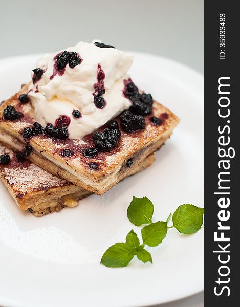 French toast with blueberry jam and whip-cream. French toast with blueberry jam and whip-cream