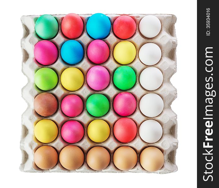 Multicolored Easter eggs in the cardboard box isolated on a white background