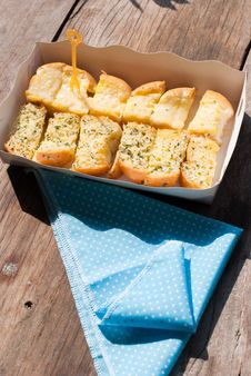 Fresh-baked Garlic Bread With Herbs, On White Bread Tray Royalty Free Stock Image Fresh-baked Garlic Bread With Herbs, On White Bread Tray Royalty Free Stock Image