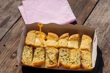 Fresh-baked Garlic Bread With Herbs, On White Bread Tray Stock Images Fresh-baked Garlic Bread With Herbs, On White Bread Tray Stock Images