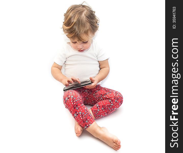 Little kid playing smartphone on white background. Little kid playing smartphone on white background