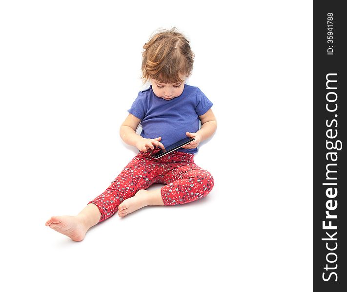 Little kid playing smartphone on white background. Little kid playing smartphone on white background