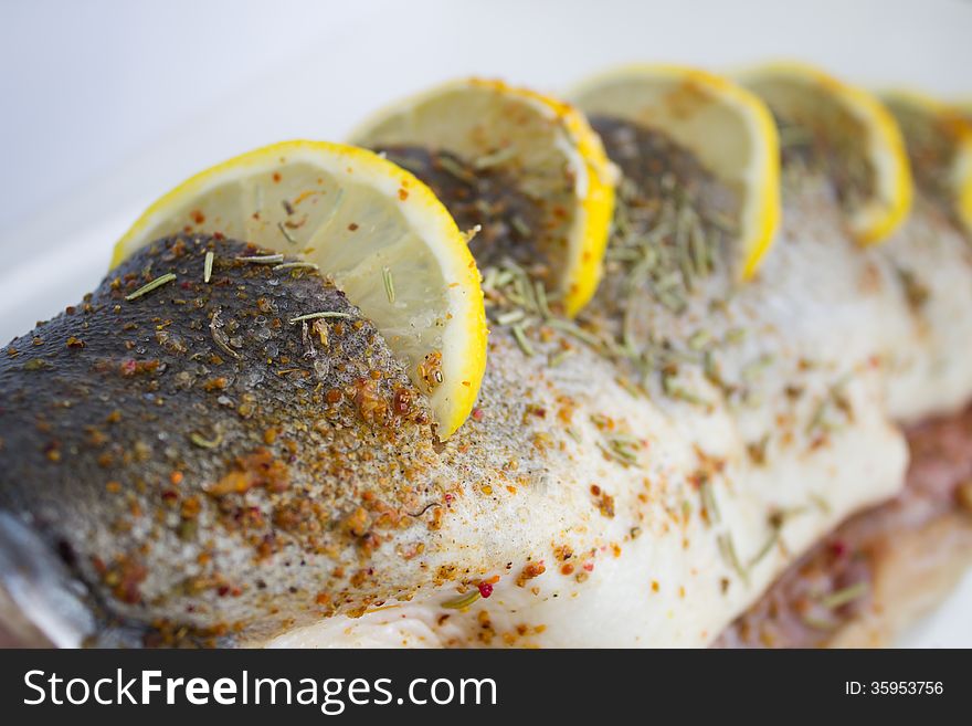 Fresh Pink Salmon prepared for cooking with Lemon and spice