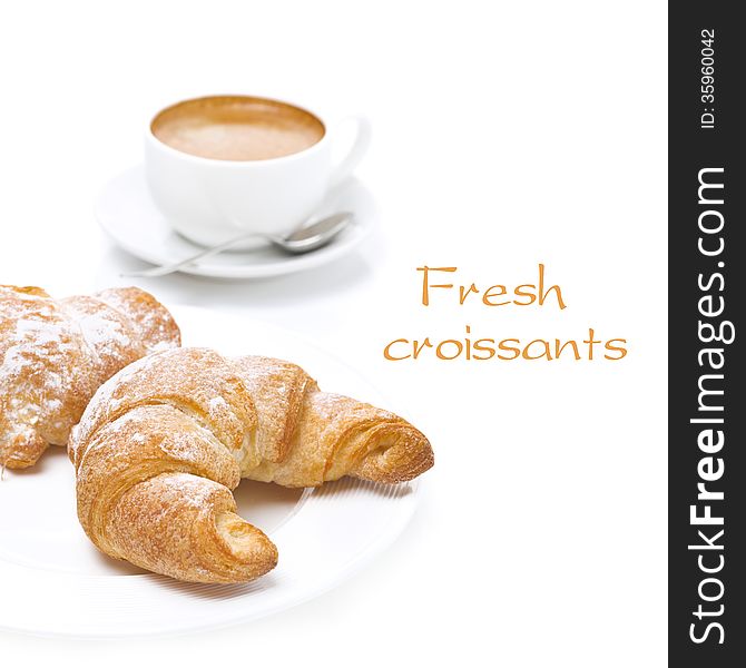 Fresh croissants and cup of coffee, isolated on white