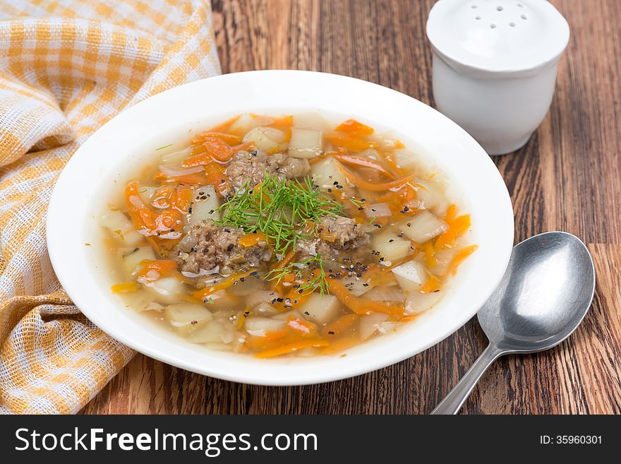 Vegetable soup with meatballs in the plate