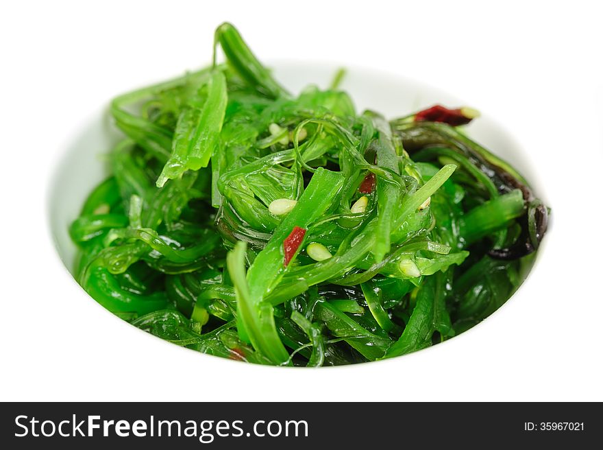 Japanese salad сhuka seaweed with sesame seeds, macro closeup. Japanese salad сhuka seaweed with sesame seeds, macro closeup