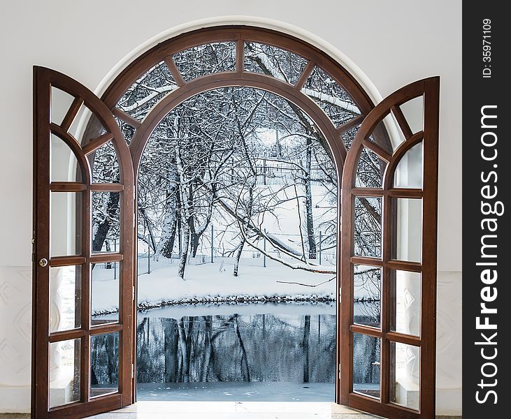 Open door and a winter forest