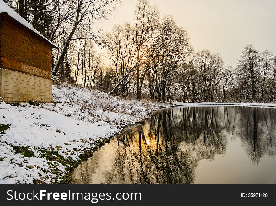 Landscape is not still pond with snowy shore. Landscape is not still pond with snowy shore