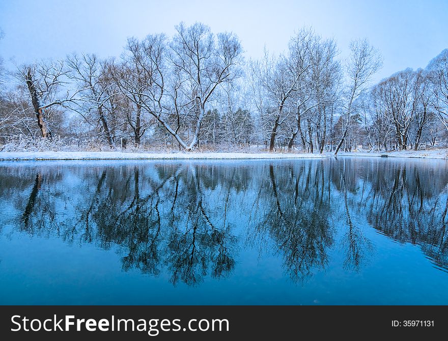 Not frozen pond in winter