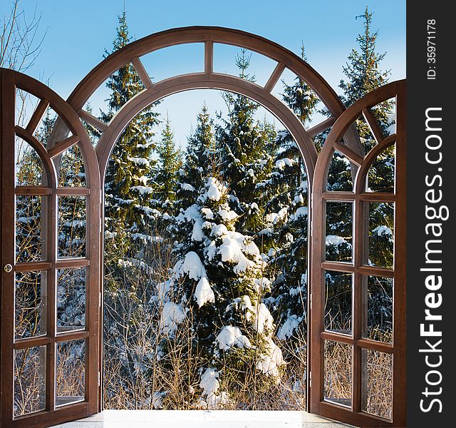 Open arched door with views of the natural landscape