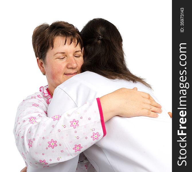 A senior woman and doctor hugging