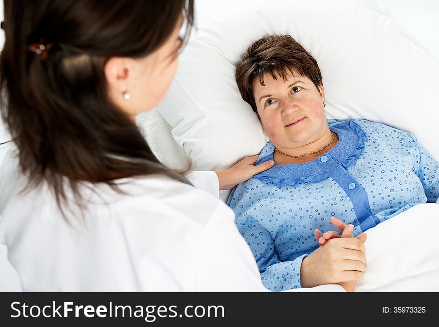 Doctor and patient in hospital room