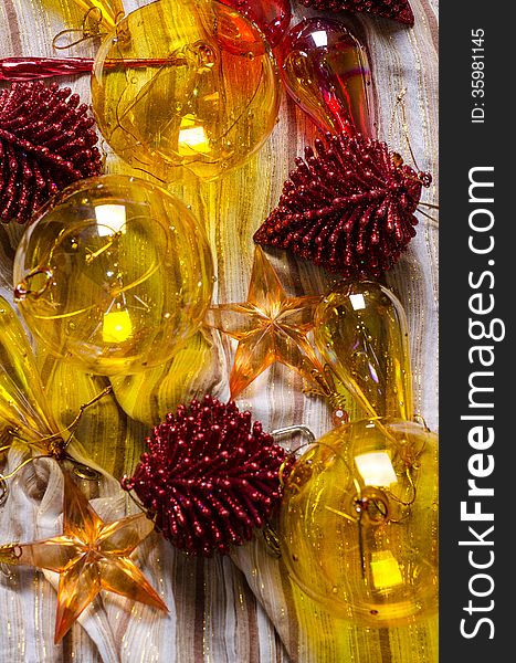 Old glass Christmas ornaments on festive cloth