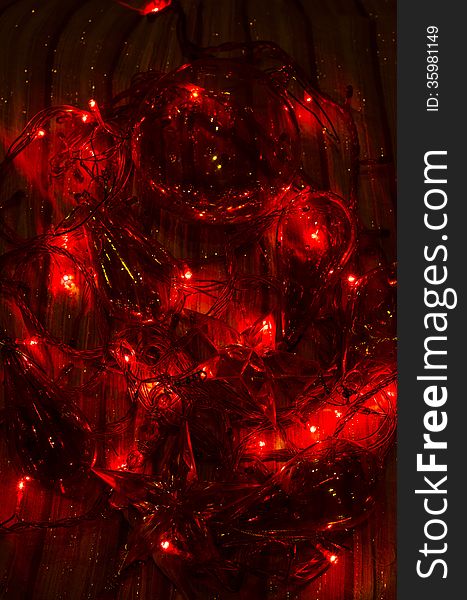 Dark background with Christmas ornaments- baubles and lights