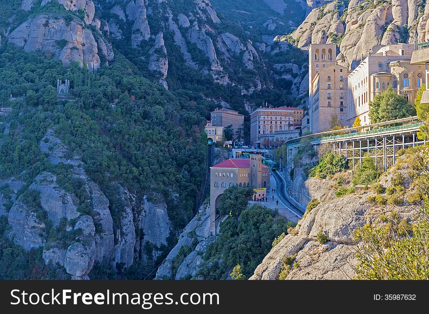 Montserrat, Spain - December 7, 2013: The Benedictine abbey Santa Maria de Montserrat on December 7, 2013 in Monistrol de Montserrat, Spain. It hosts the Virgin of Montserrat, the favorite in Catalonia. Montserrat, Spain - December 7, 2013: The Benedictine abbey Santa Maria de Montserrat on December 7, 2013 in Monistrol de Montserrat, Spain. It hosts the Virgin of Montserrat, the favorite in Catalonia