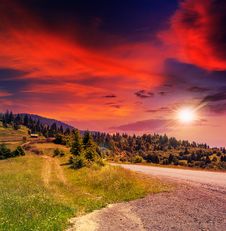 Mountain Road Near The Coniferous Forest With Cloudy Morning Sky Royalty Free Stock Photography Mountain Road Near The Coniferous Forest With Cloudy Morning Sky Royalty Free Stock Photography