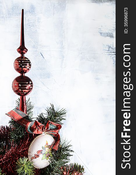 Christmas decoration on the tree with white background and red garlands.