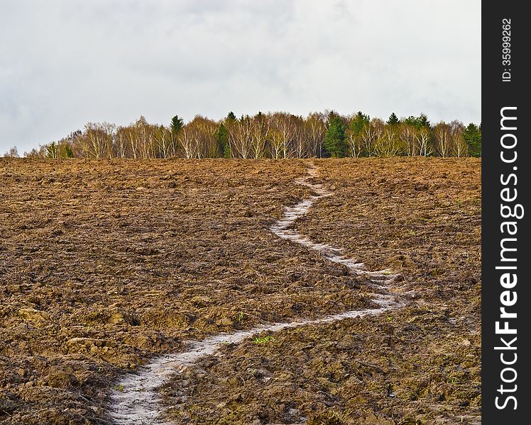 The path through the plowed field. The path through the plowed field