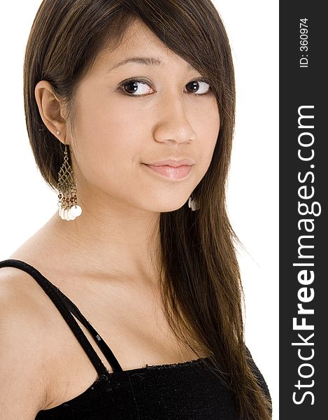 A pretty young asian girl in black on white looks to the side. A pretty young asian girl in black on white looks to the side