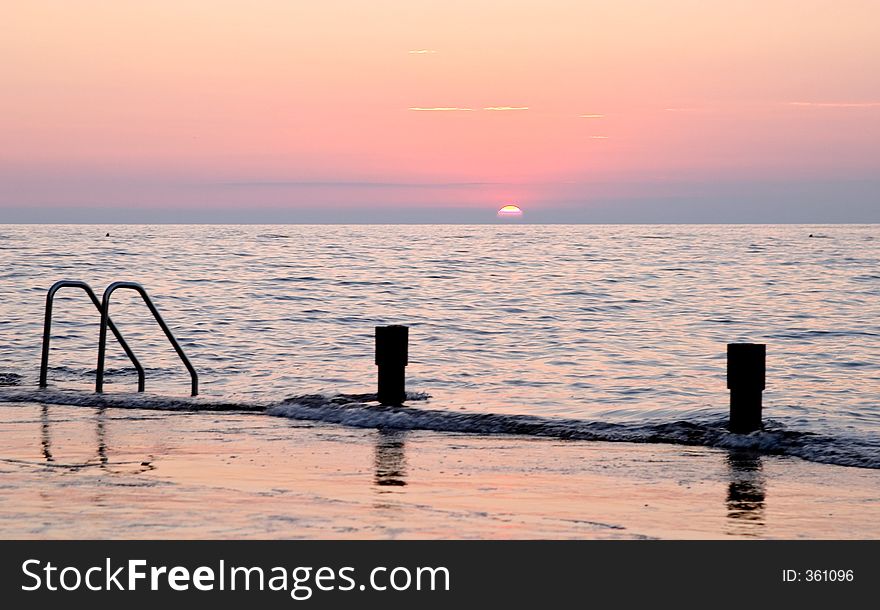 Spectacular sea sunset from the beach of the naturist camping of Cervar Porec (Parenzo), Istria, Croatia