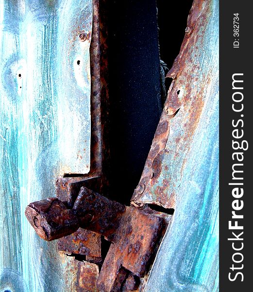 A rusty old padlock is the only think holding this abstract shed together. A rusty old padlock is the only think holding this abstract shed together.