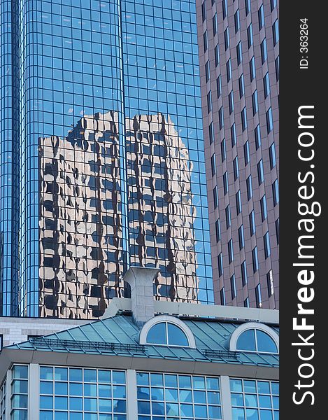 It shows the reflection of a multisory building. It shows the reflection of a multisory building