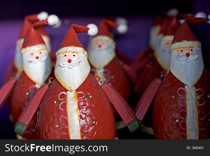 Rows Of Funny Santas For Sale On A Shelf