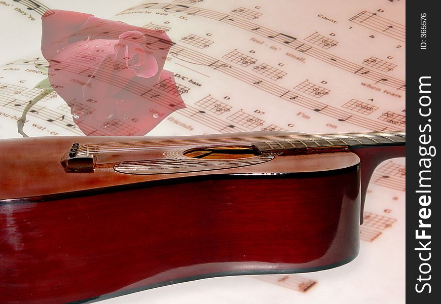 Acoustical guitar resting on an opened page of sheet music with a opaqued rose in the background. Acoustical guitar resting on an opened page of sheet music with a opaqued rose in the background.