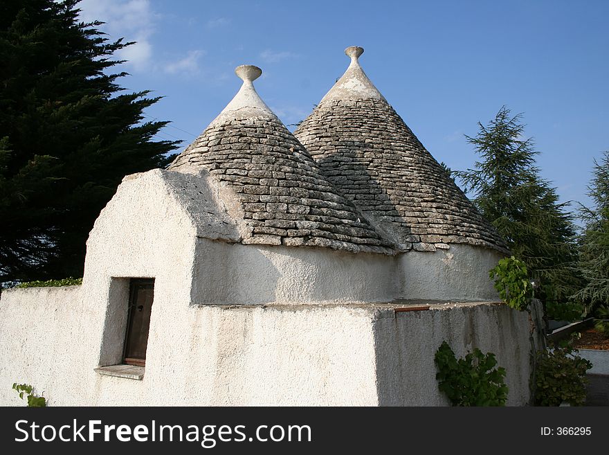 Alberobello, South Italy Very interesant area of history conical roofs. The trullo is an ancient building wirh singular shape,distinguished by its typical conical roof.