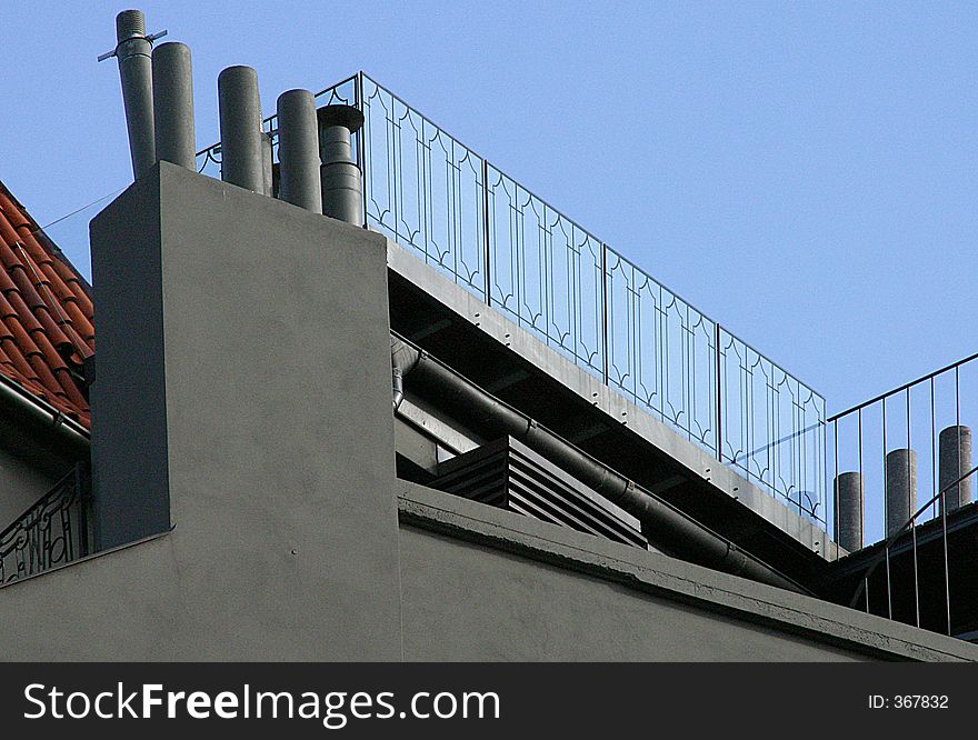 Details of architectural details of a modern villa, with a blue sky in the back.