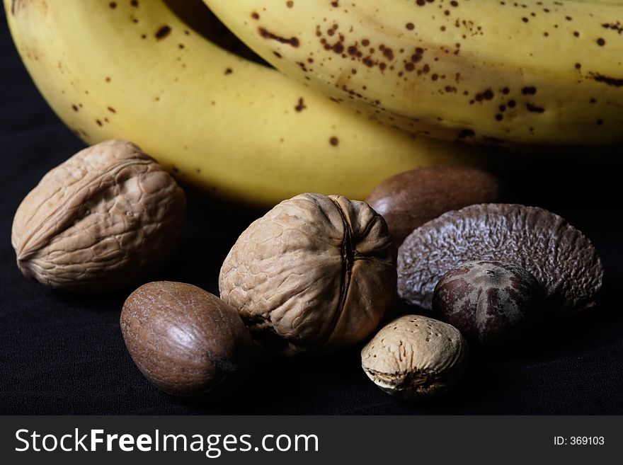 Mixed nuts beside bananas
