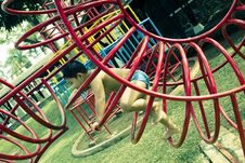 Kid Playing In Playground Stock Photo