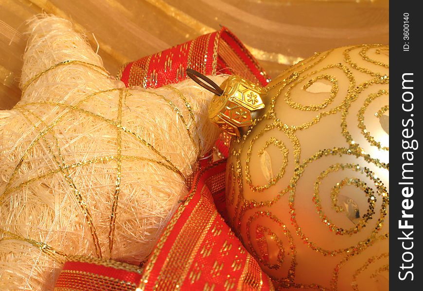 Christmas background with  golden ball, stars and red ribbons. Christmas background with  golden ball, stars and red ribbons