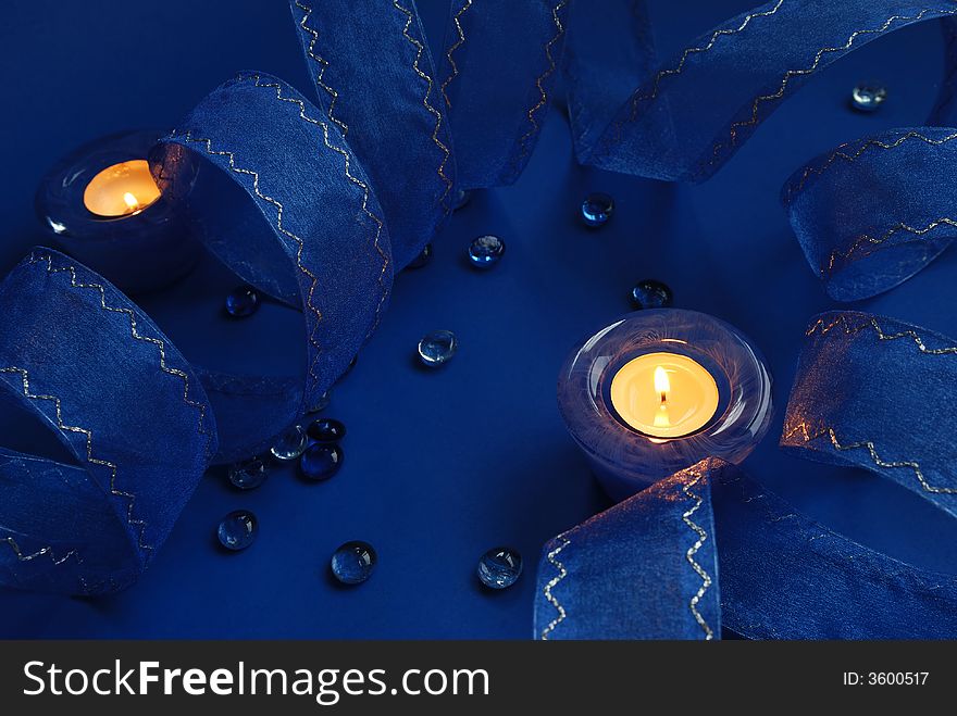 Blue candles and ribbon