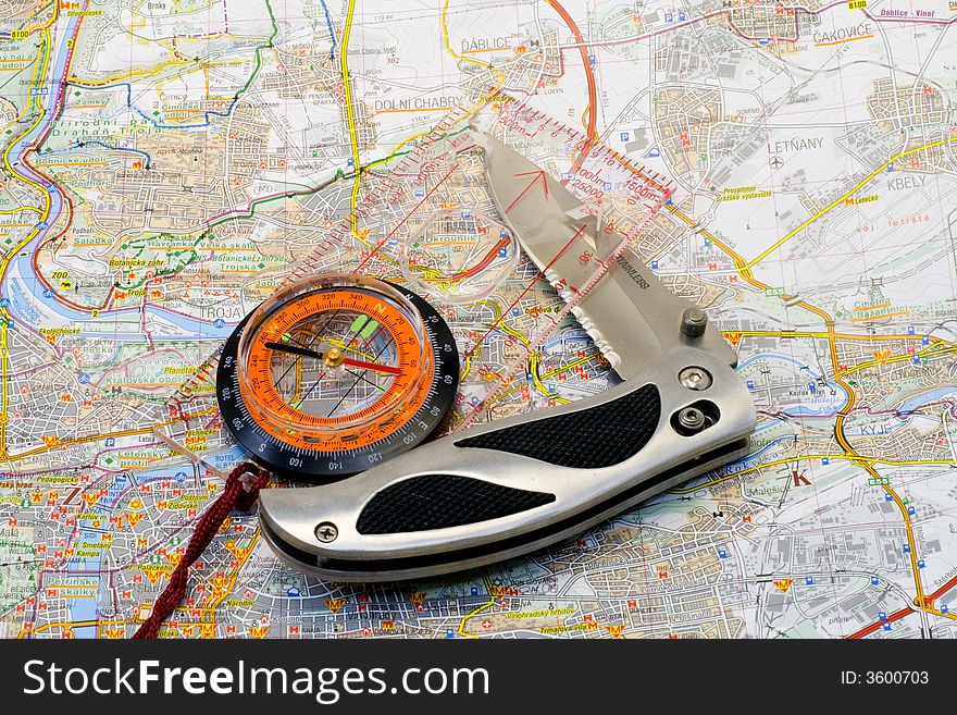 Compass and knife on a map