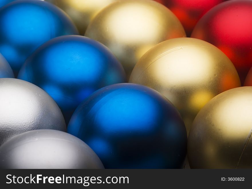 Close up  of some diagonal row of colored Christmas' ball. Close up  of some diagonal row of colored Christmas' ball