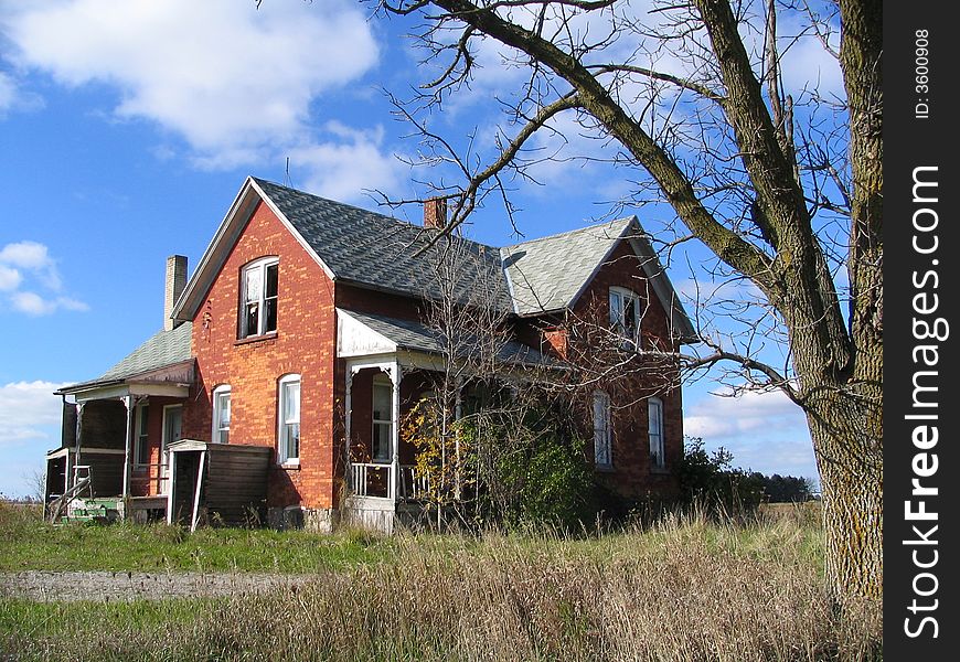 An old abandoned farmhouse in the middle of nowhere.