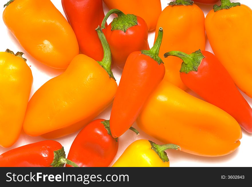 Fresh sweet peppers on white background, with copy space