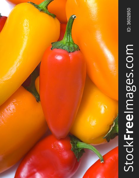 Fresh sweet peppers on white background, with copy space